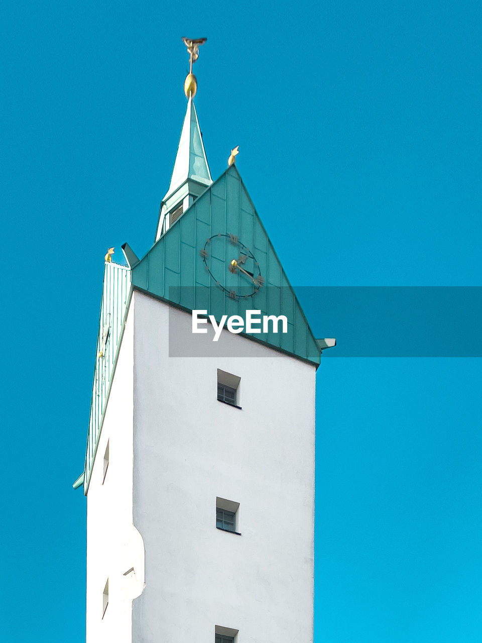 Low angle view of building against clear blue sky