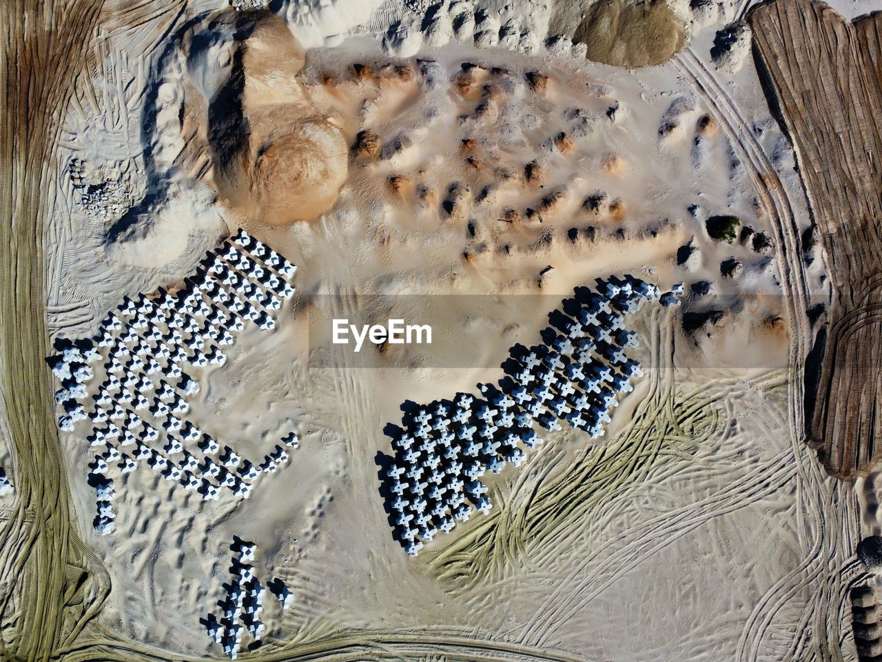 High angle view of sand with concrete constructions