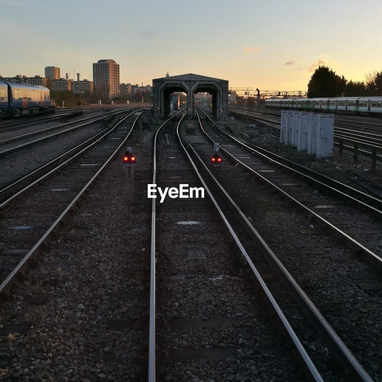 Railway tracks against sky during sunset