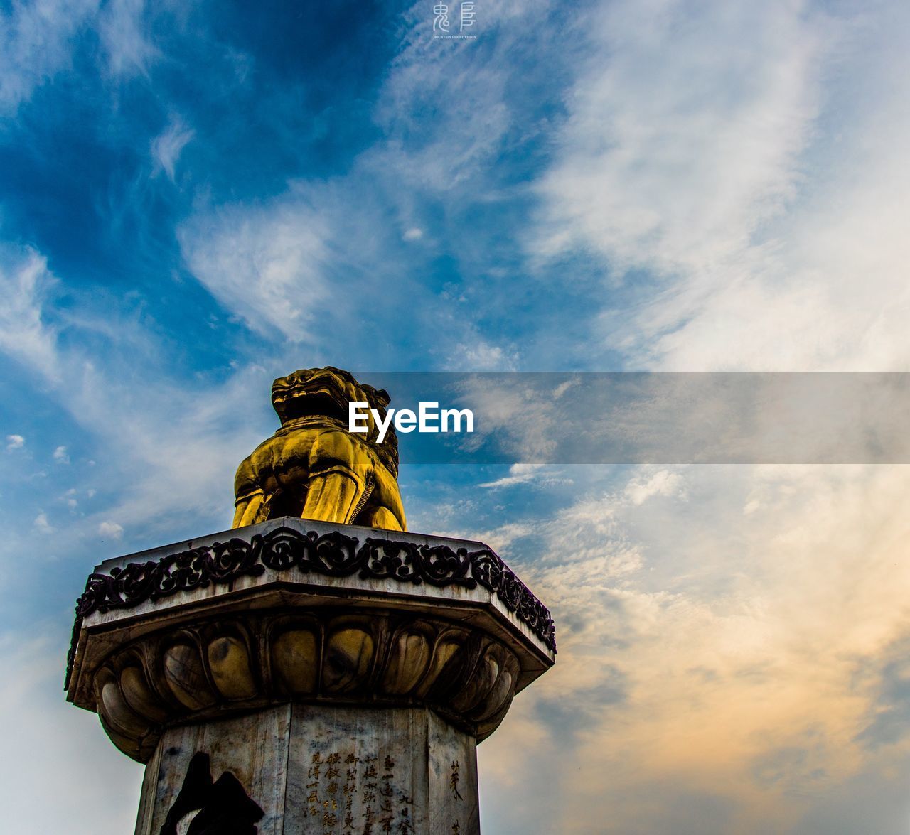 Low angle view of statue against sky