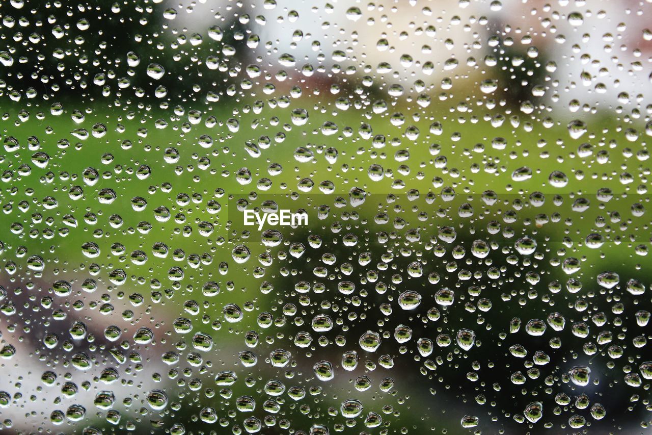 Full frame shot of wet glass window