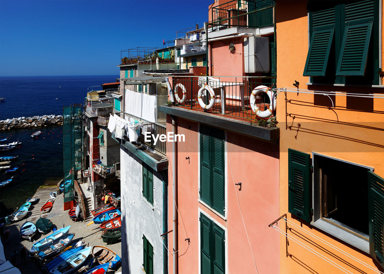 High angle view of residential buildings by harbor