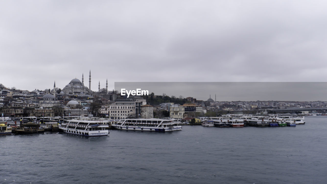 Ferry terminal cloudy weather dark clouds winters in istanbul, ottoman imperial mosque, 