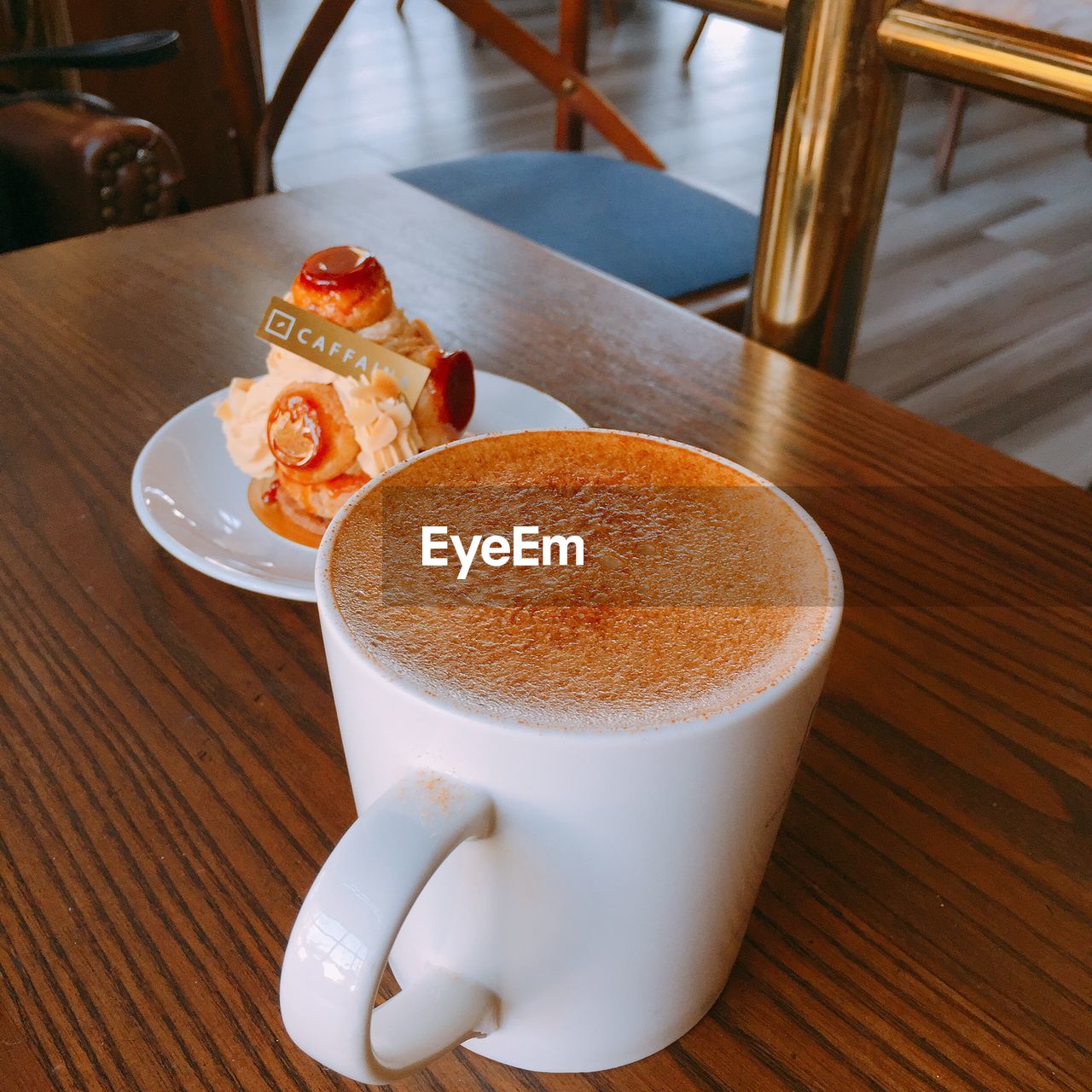 CLOSE-UP OF COFFEE CUP ON TABLE