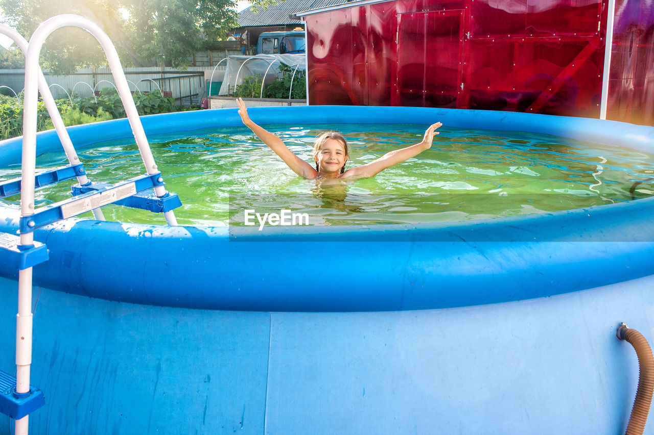 Girl swimming in wading pool