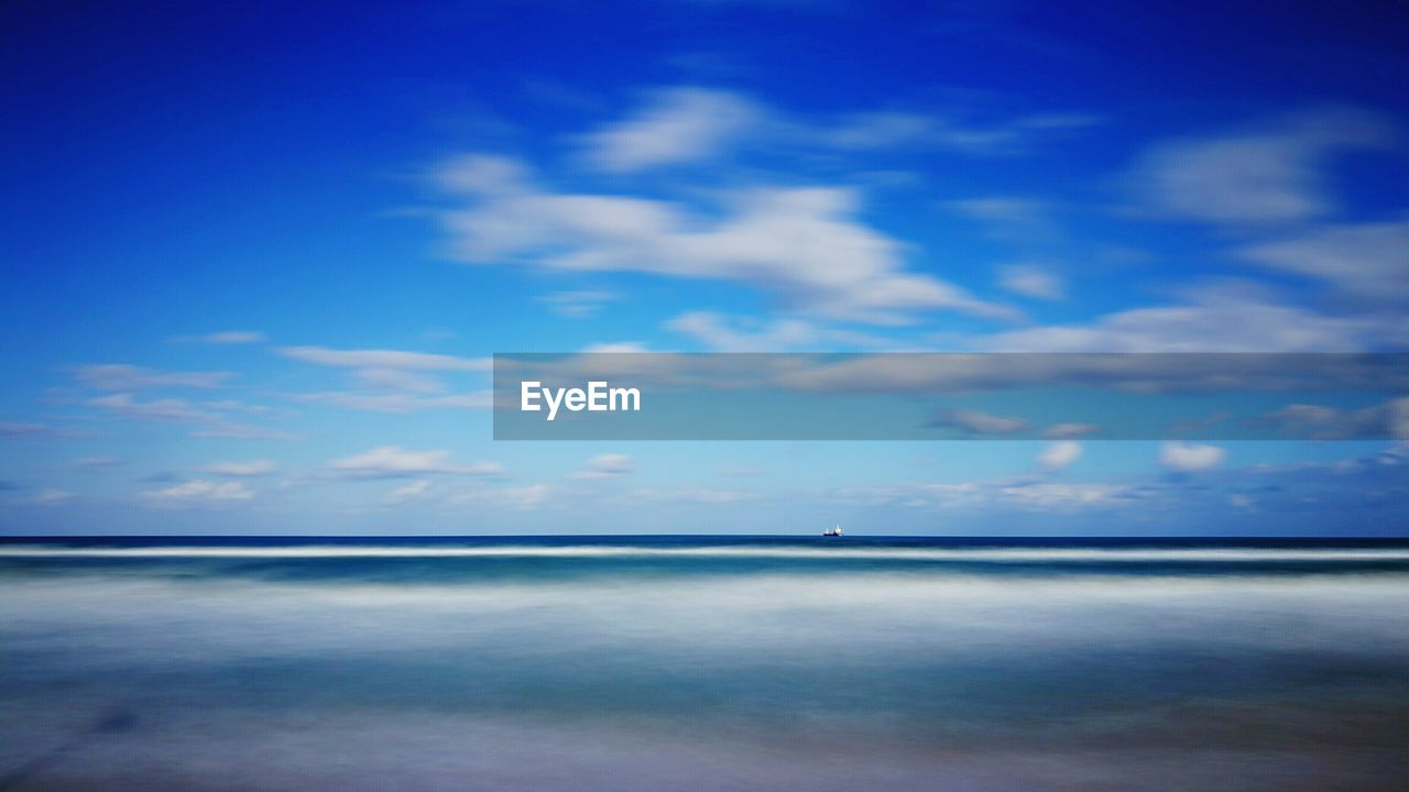 VIEW OF SEA AGAINST BLUE SKY