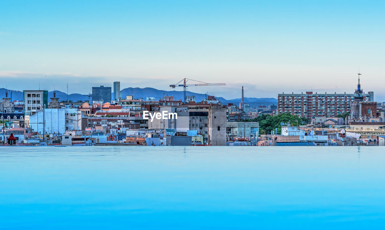 CITYSCAPE AGAINST CLEAR BLUE SKY