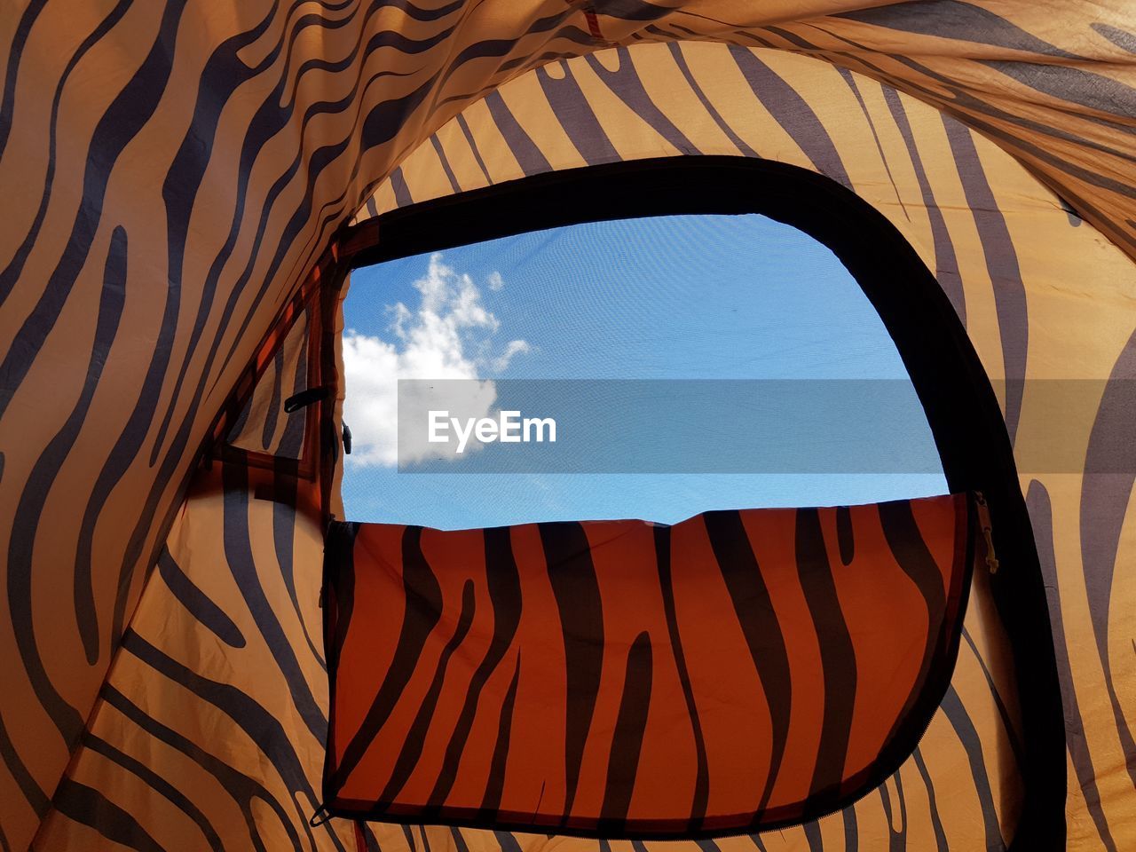 Low angle view of sky seen through tent door