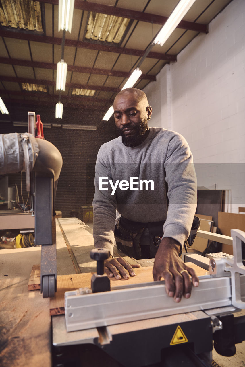 Carpenter working at workshop