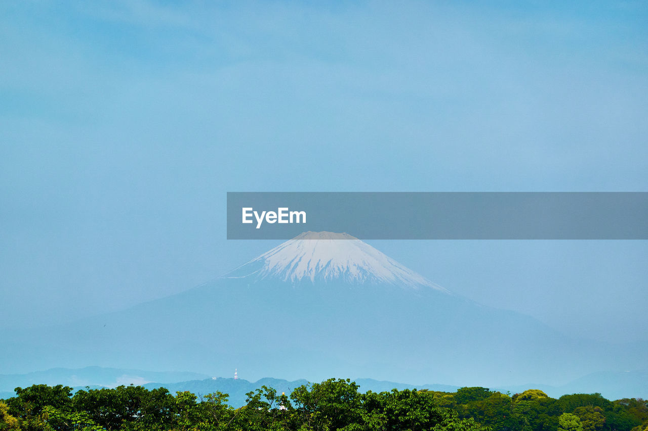 Scenic view of volcanic mountain against sky