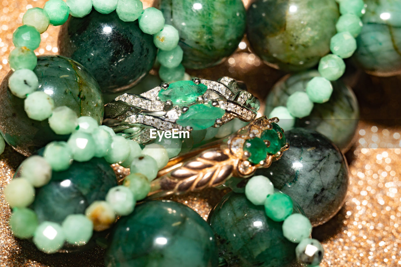 Natural emerald, beryl beaded bracelet, necklace and yellow gold ring.