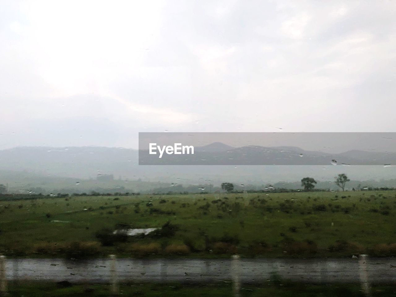 SCENIC VIEW OF LANDSCAPE DURING RAINY SEASON
