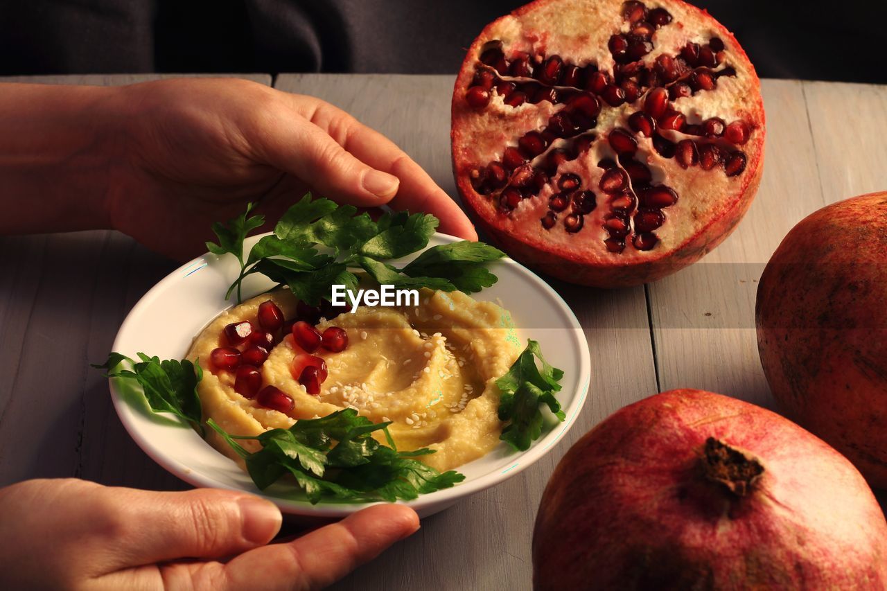 MIDSECTION OF PERSON HOLDING SALAD