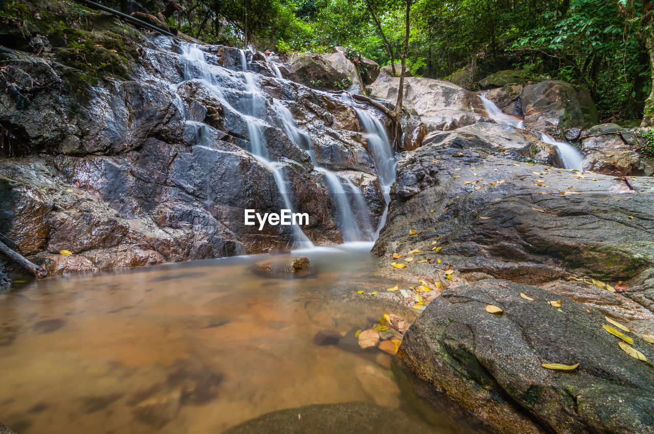 Scenic shot of waterfall along rocks