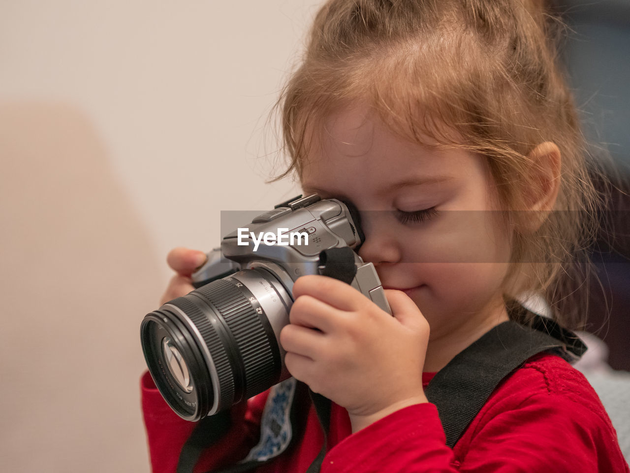 childhood, child, one person, portrait, headshot, person, camera, holding, technology, female, activity, women, indoors, photographing, close-up, casual clothing, singing, red, blond hair, front view, human face, occupation, looking through an object, looking, creativity, photographer, men, cute