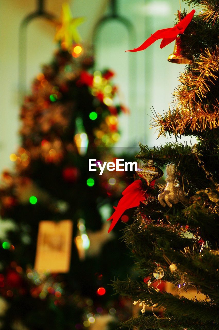 Close-up of christmas tree with ornaments at home