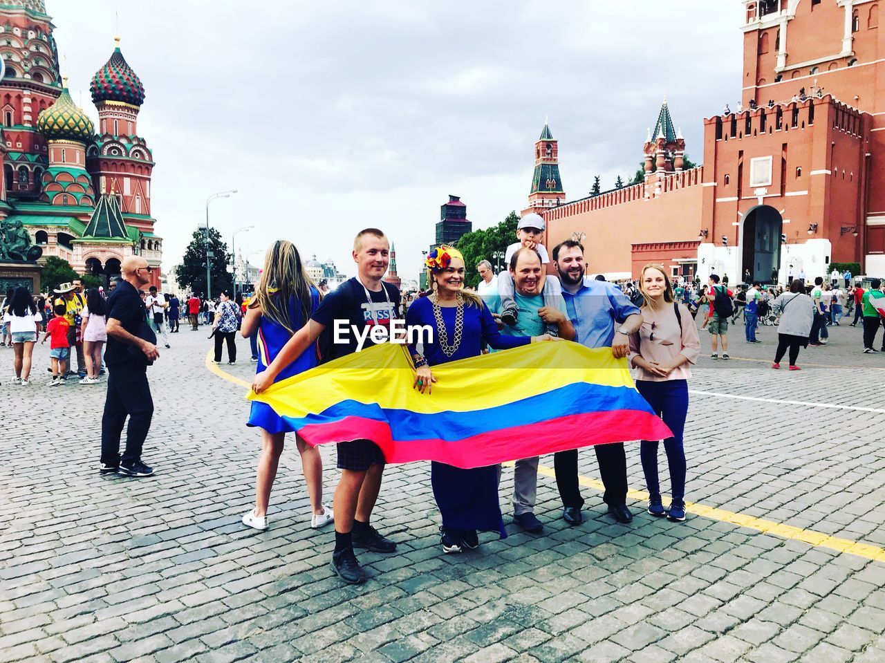 GROUP OF PEOPLE STANDING ON STREET