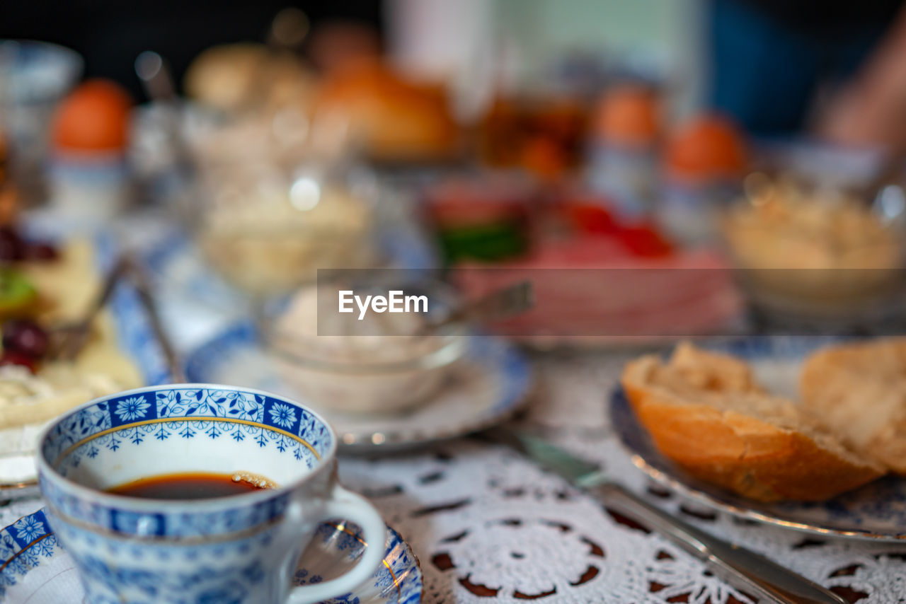 CLOSE-UP OF TEA SERVED ON TABLE IN KITCHEN