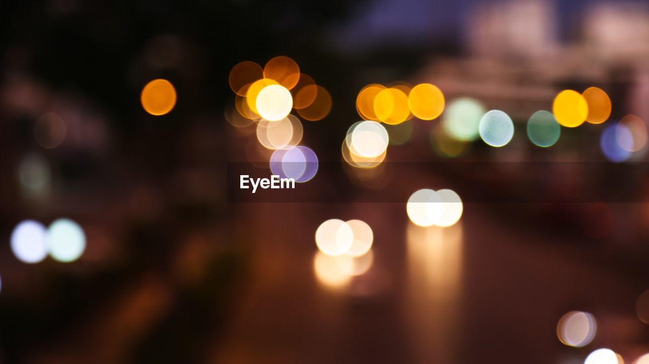 Defocused image of illuminated lights at night