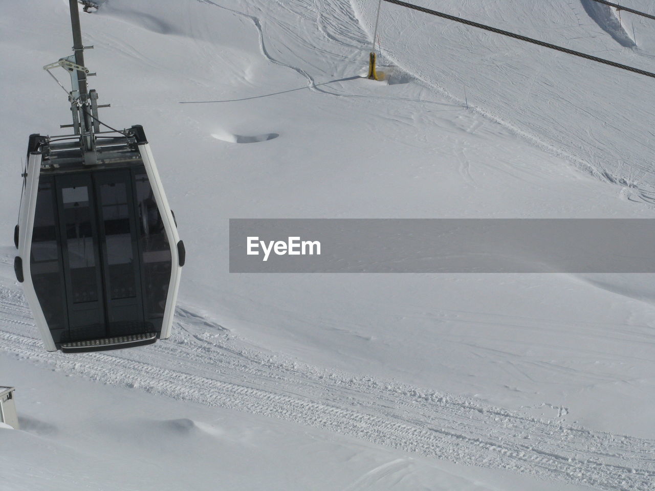 Ski lift over snow covered field