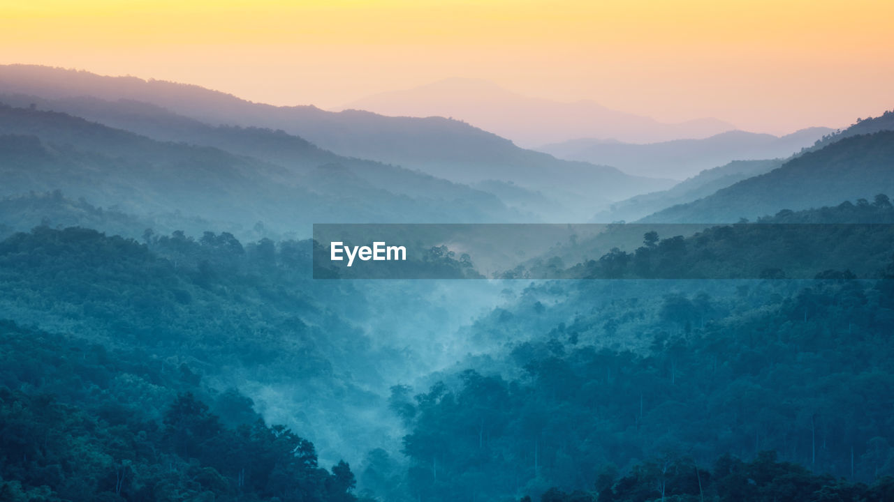 Scenic view of mountains against sky during sunset