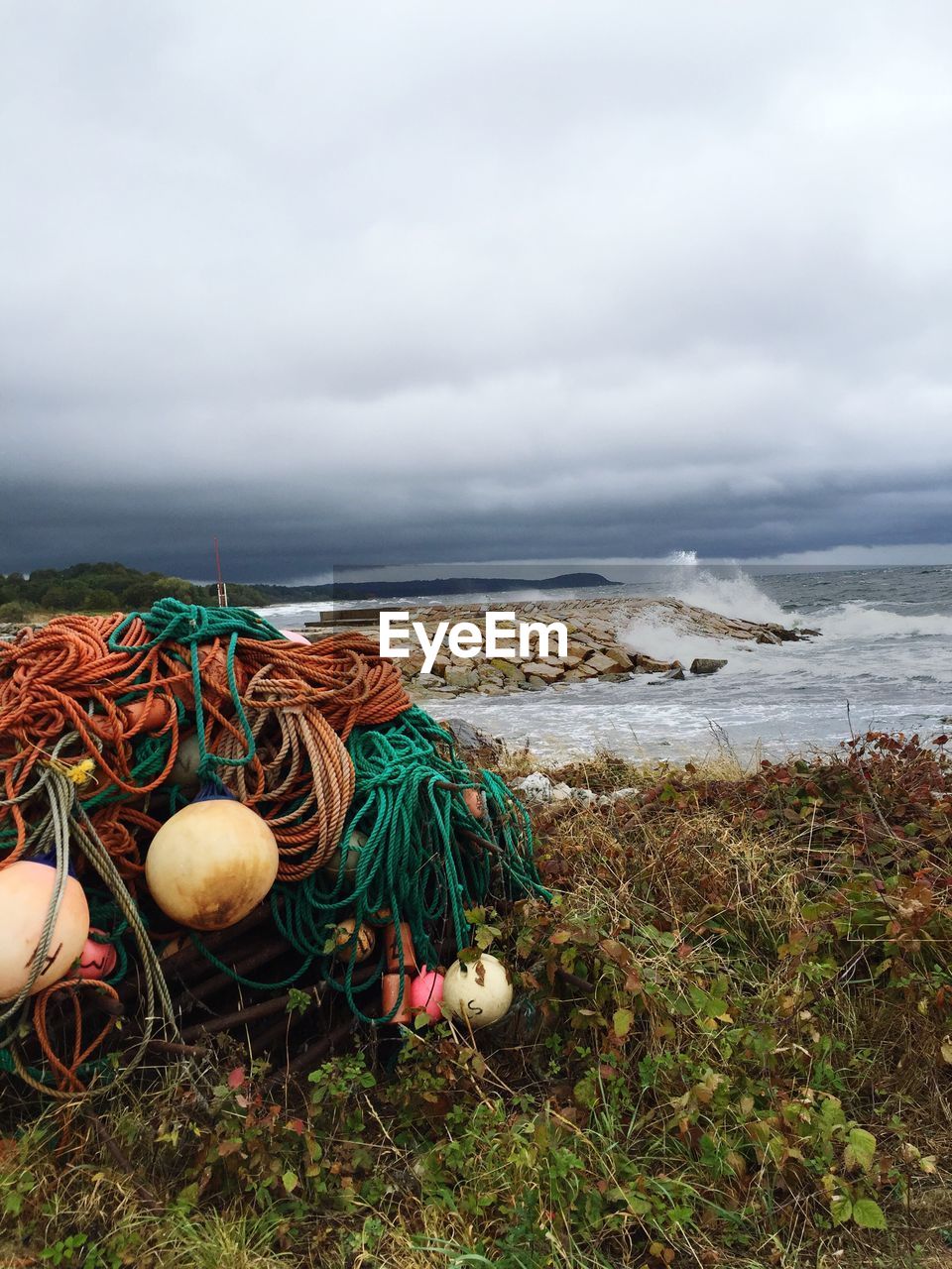 Scenic view of sea against cloudy sky