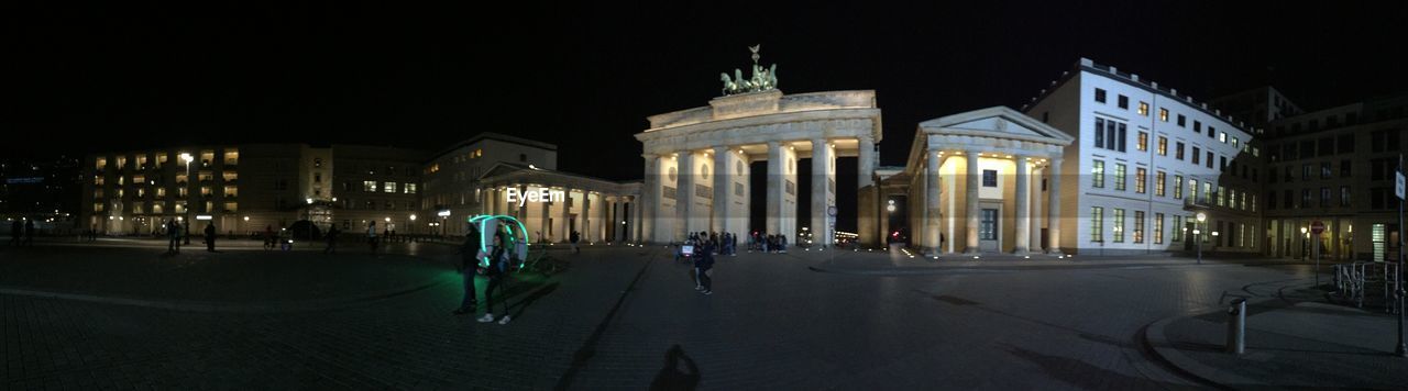 VIEW OF ILLUMINATED BUILDING AT NIGHT