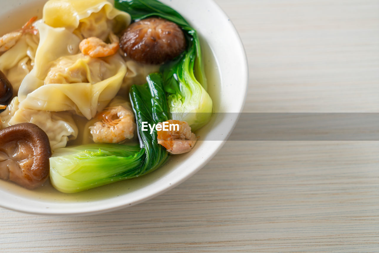 food, food and drink, healthy eating, vegetable, wellbeing, cuisine, dish, freshness, meal, meat, asian food, produce, indoors, no people, table, bowl, close-up, pasta, plate, savory food, seafood, high angle view, dinner, wood