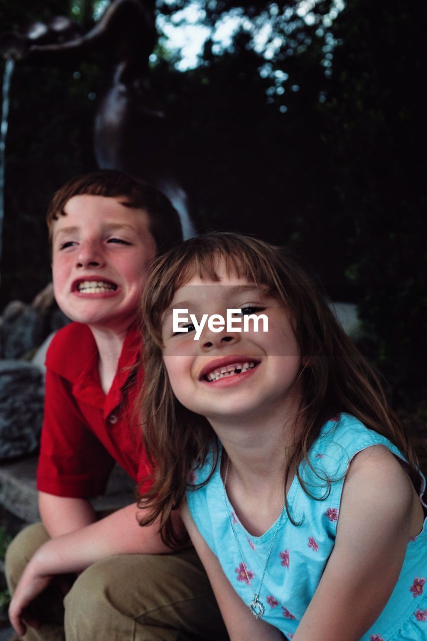 Portrait of girl with brother