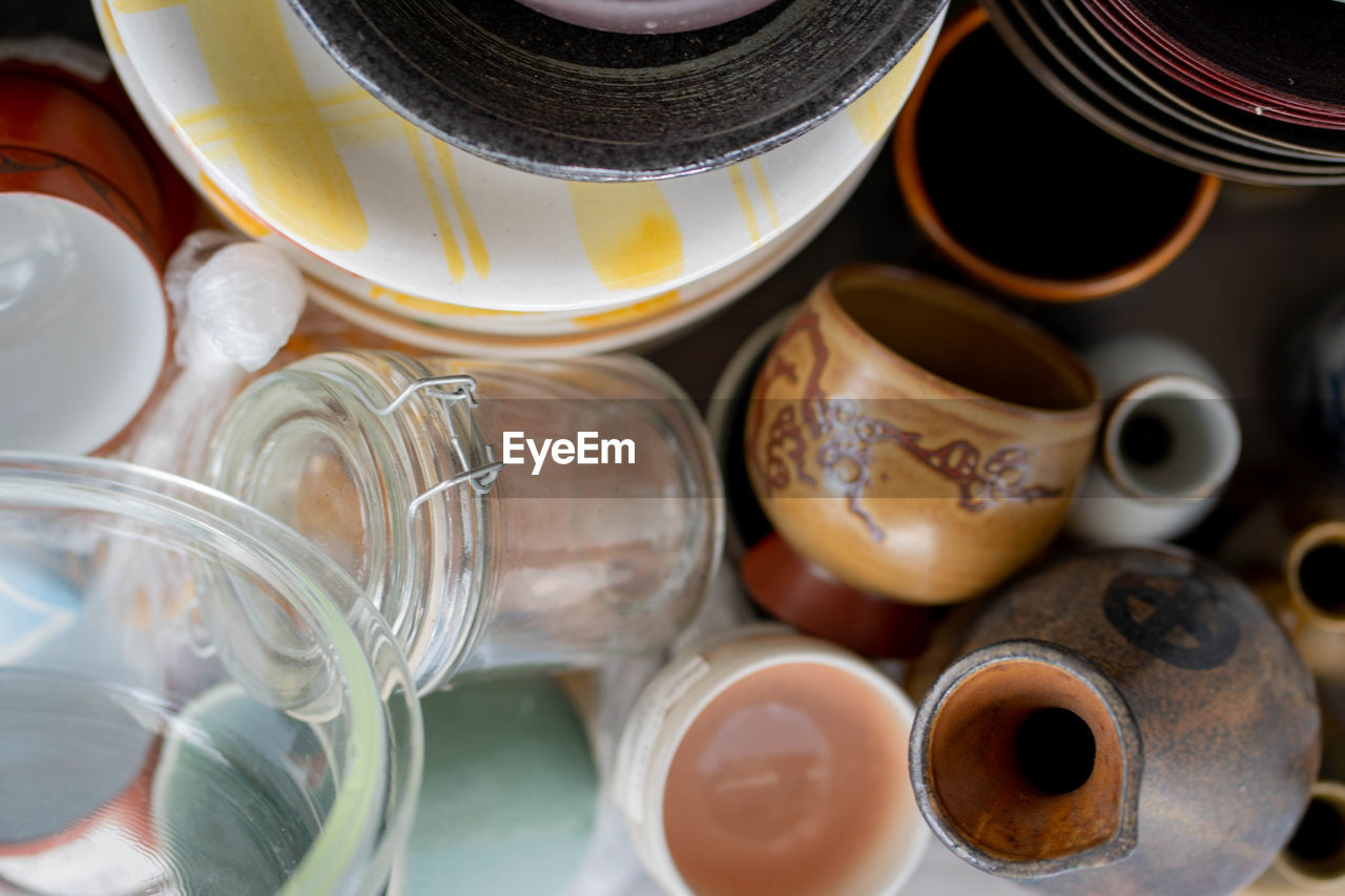 Directly above shot of jar and containers at market