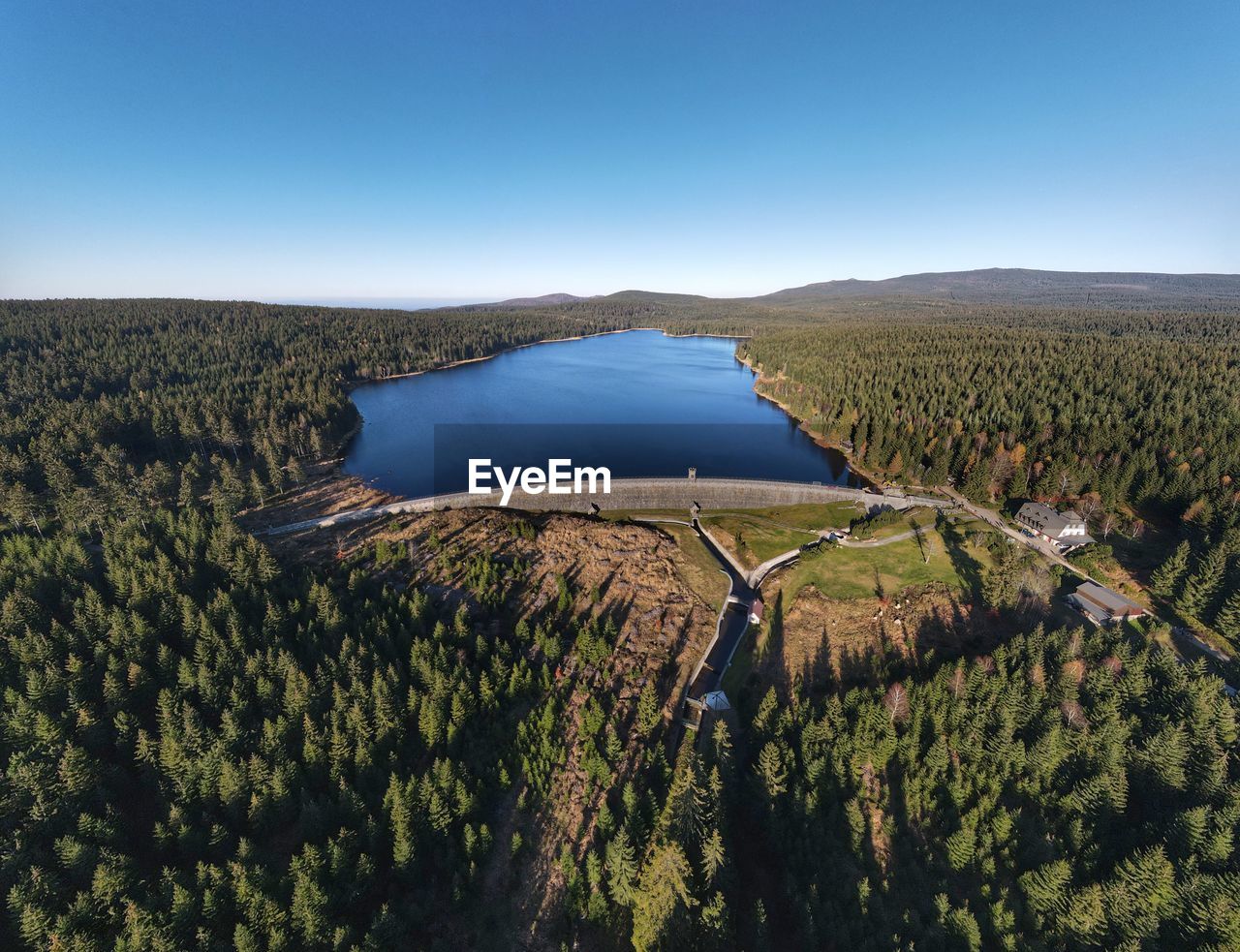 Scenic view of landscape against clear sky and dam of bedrichov