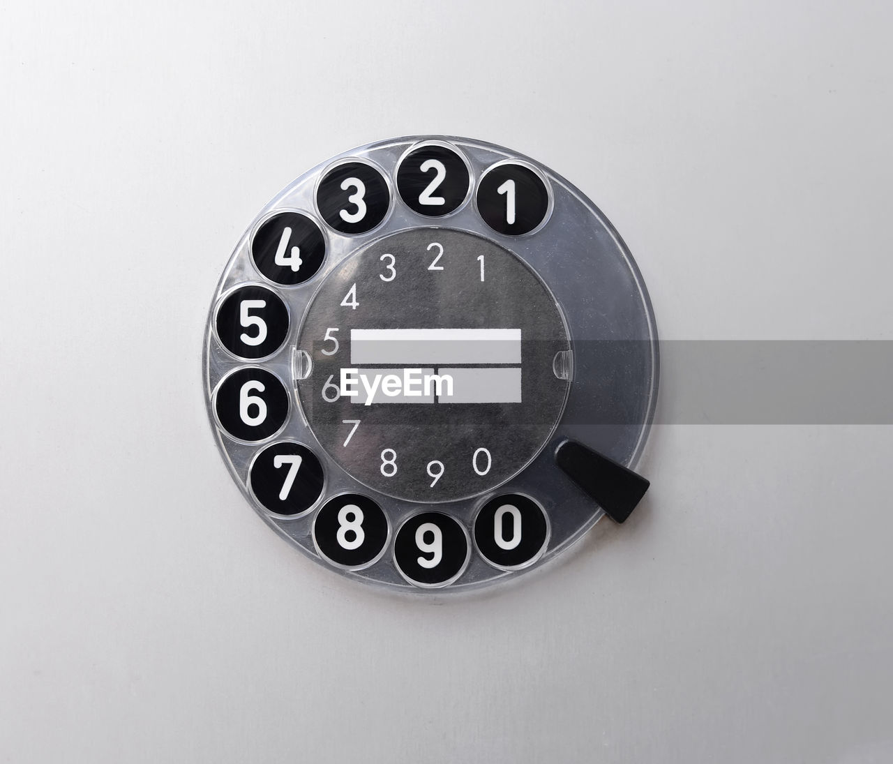 Close-up of rotary phone over white background