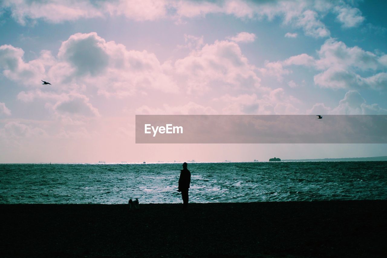 Scenic view of sea against cloudy sky