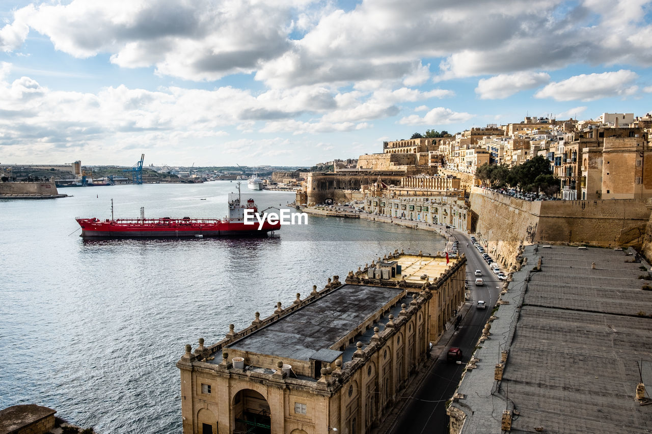 High angle view of ship in sea ant the valletta harbour against sky