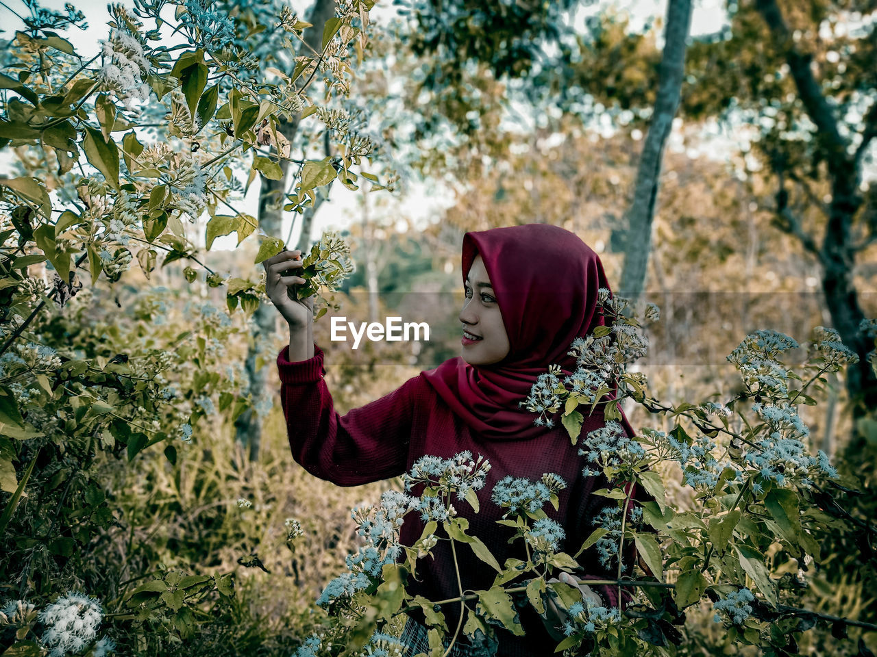 Portrait of a young woman on tree