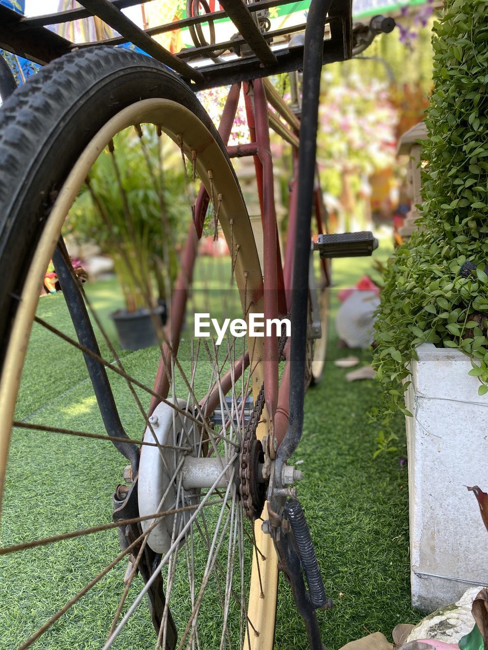 Close-up of bicycle wheel on field