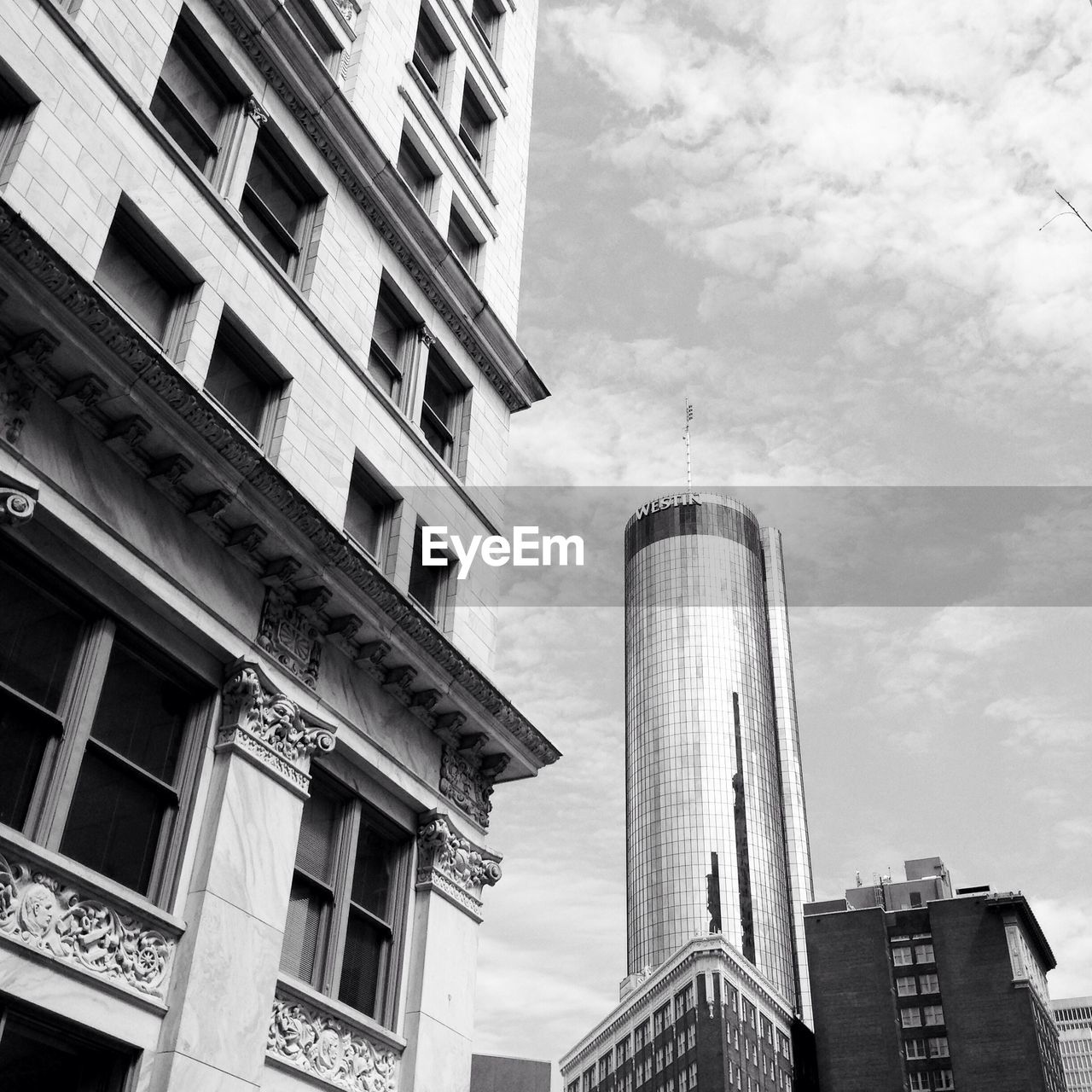 LOW ANGLE VIEW OF MODERN BUILDINGS AGAINST SKY