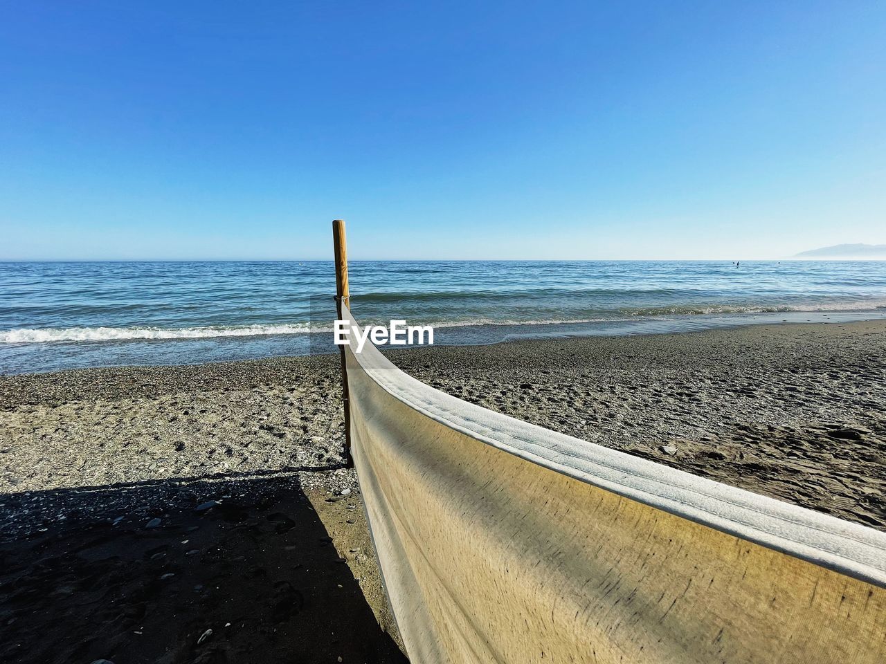 SCENIC VIEW OF BEACH AGAINST CLEAR SKY