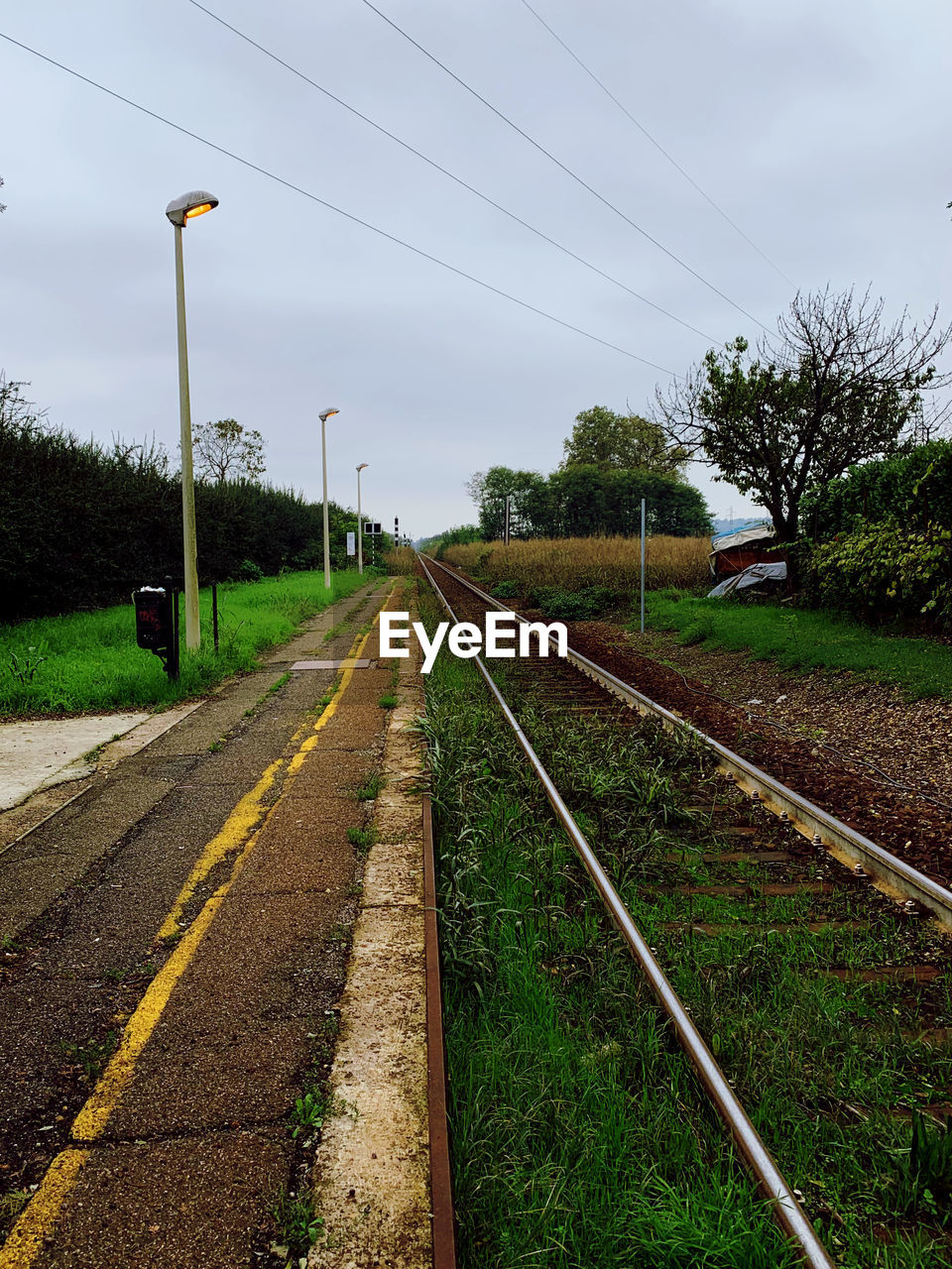 VIEW OF RAILROAD TRACK AGAINST SKY