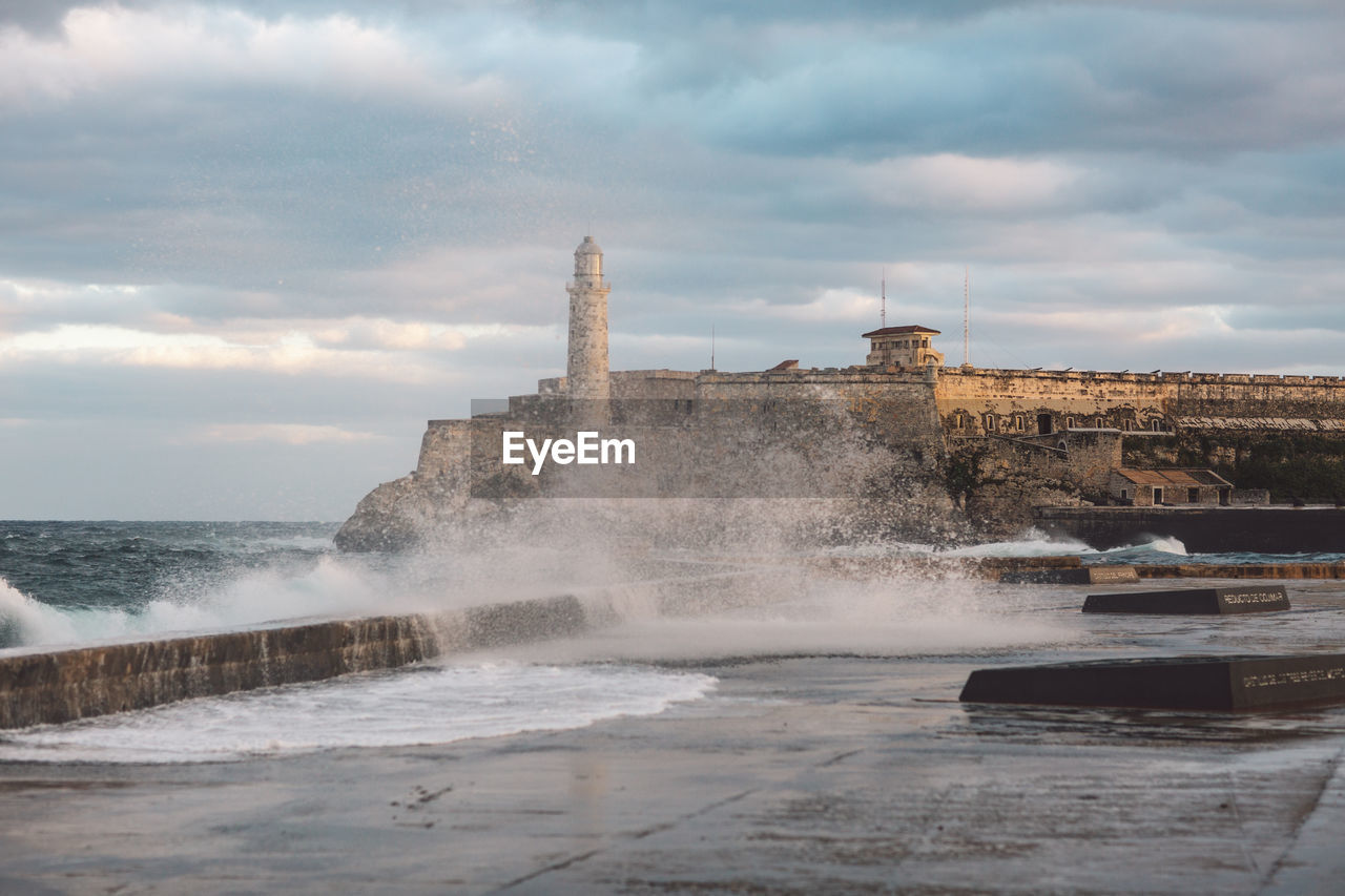 Scenic view of sea against cloudy sky