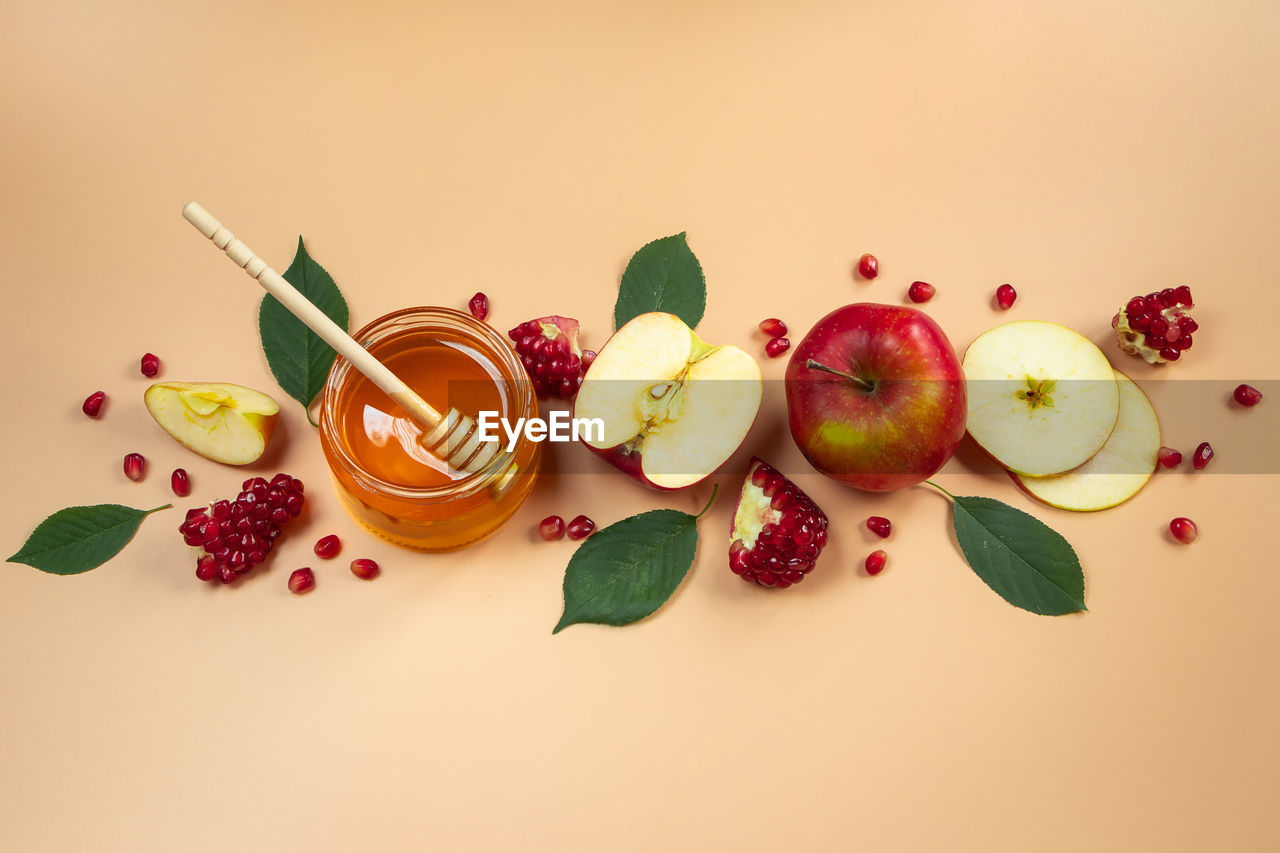 food and drink, food, fruit, healthy eating, wellbeing, freshness, berry, petal, strawberry, studio shot, red, colored background, no people, variation, still life, flower, seed, indoors, leaf, produce, organic, nature, plant part, kiwi, apple - fruit, orange color, cherry, sweet food, high angle view, citrus fruit, raspberry, pomegranate, peach, multi colored, plant, copy space