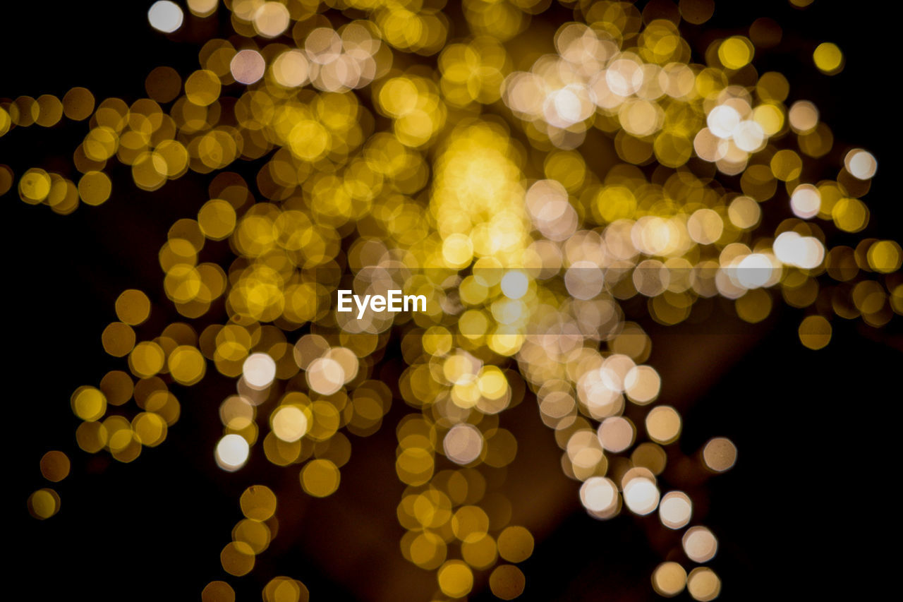 Defocused image of illuminated lights at night