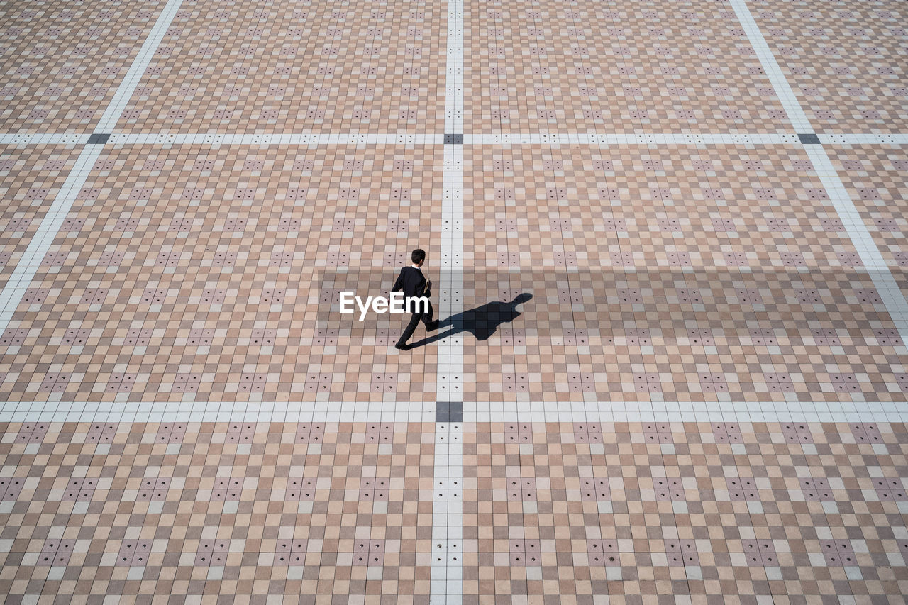 High angle view of man walking on osaka, japan