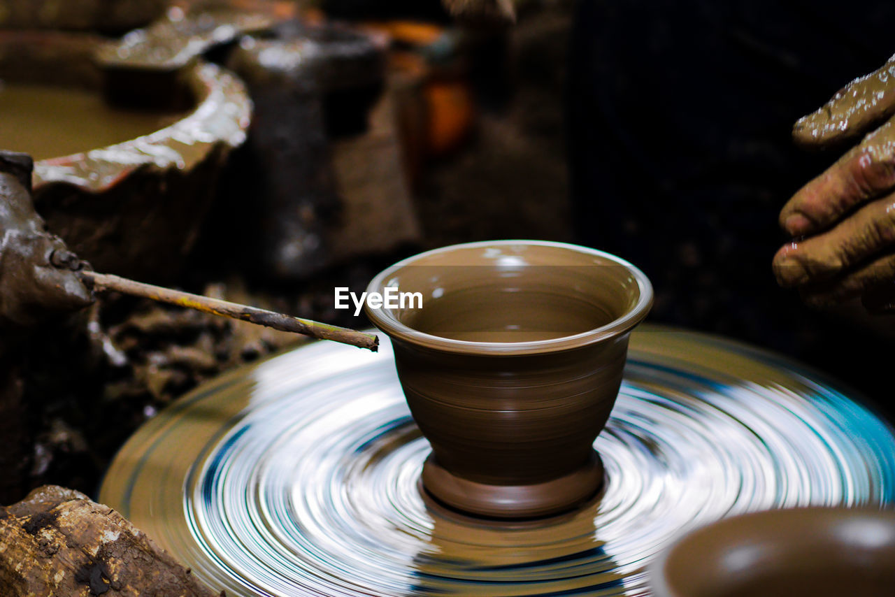 CLOSE-UP OF PERSON HAND WITH TEA