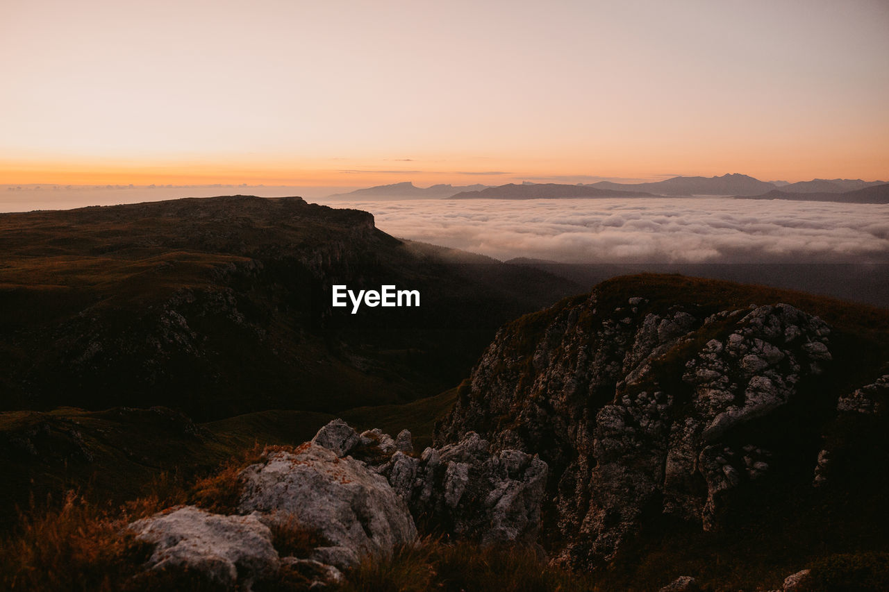 Scenic view of mountain against sky during sunset