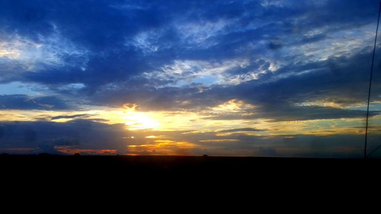 SILHOUETTE LANDSCAPE AGAINST SUNSET SKY