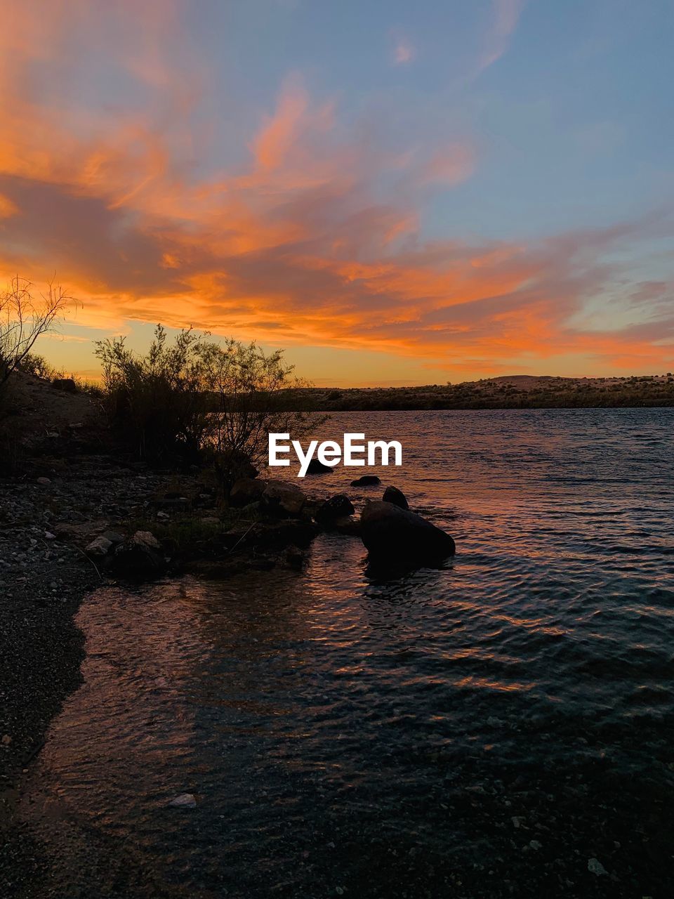 SCENIC VIEW OF SEA AGAINST ORANGE SKY