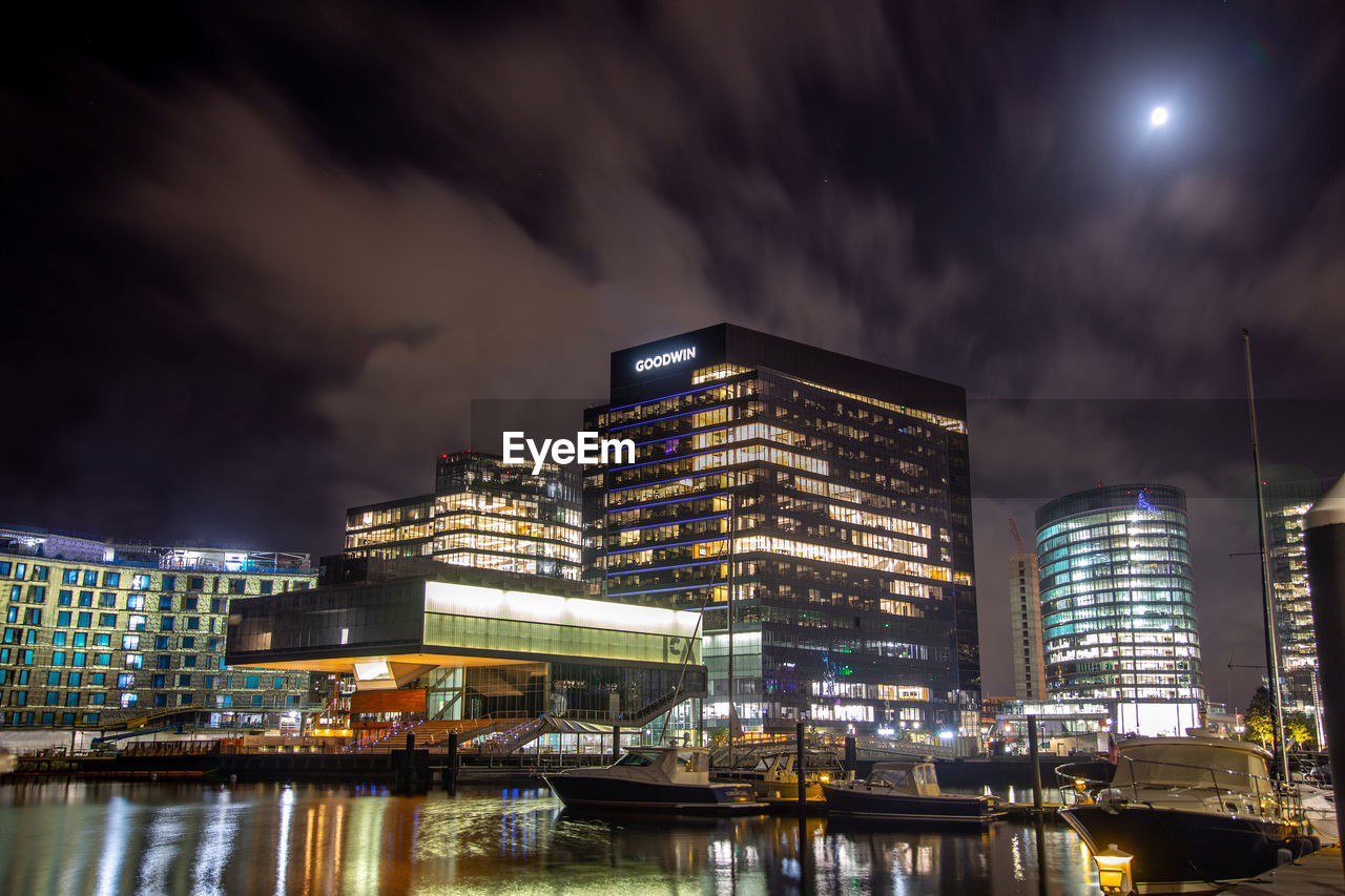 ILLUMINATED BUILDINGS AGAINST SKY AT NIGHT