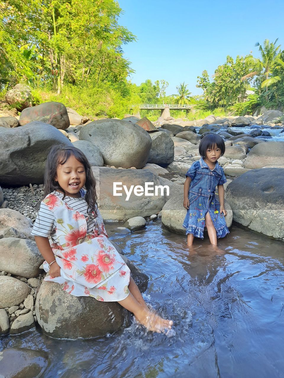 Sisters enjoying in river