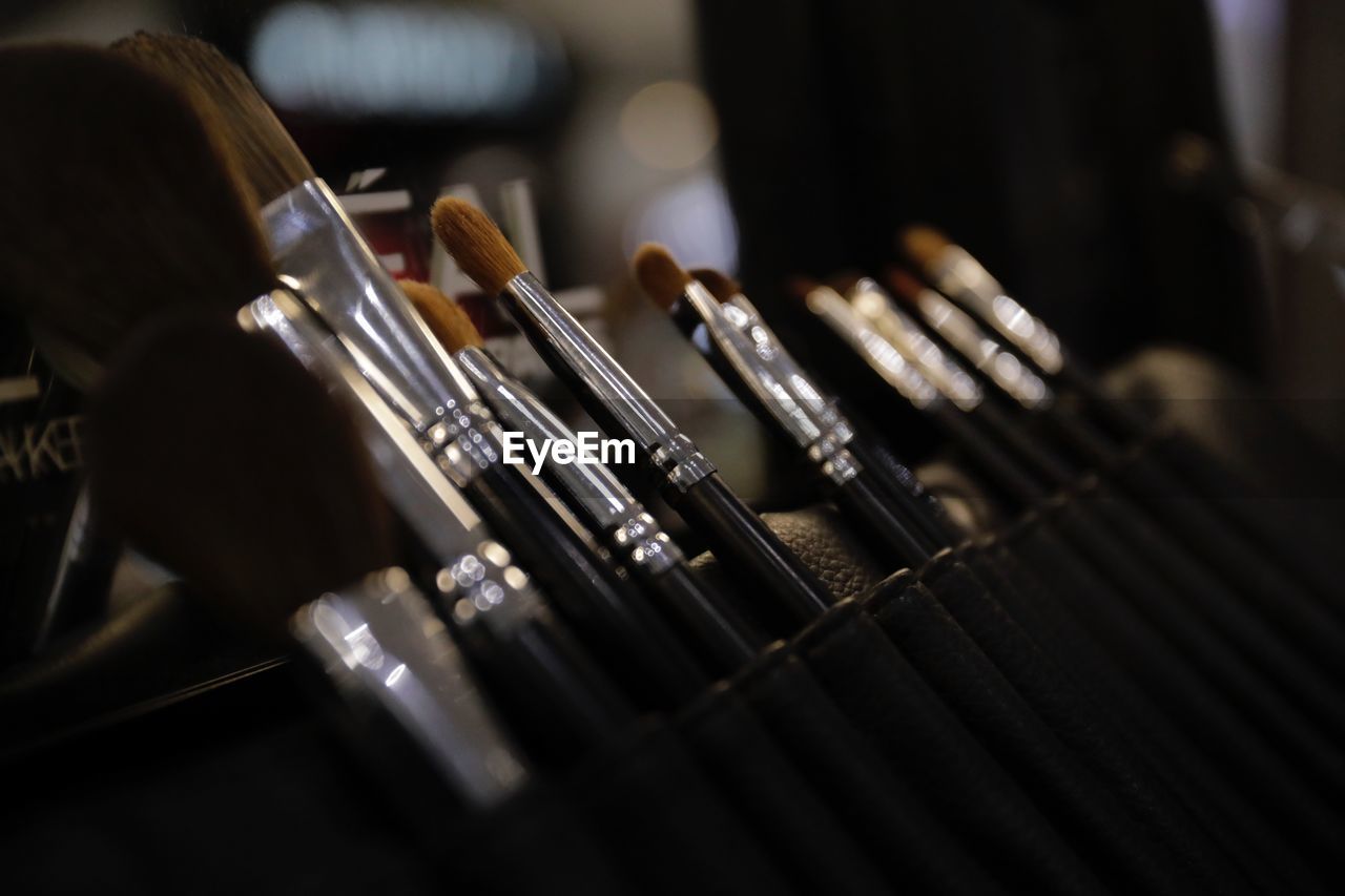 Close-up of make-brushes on table